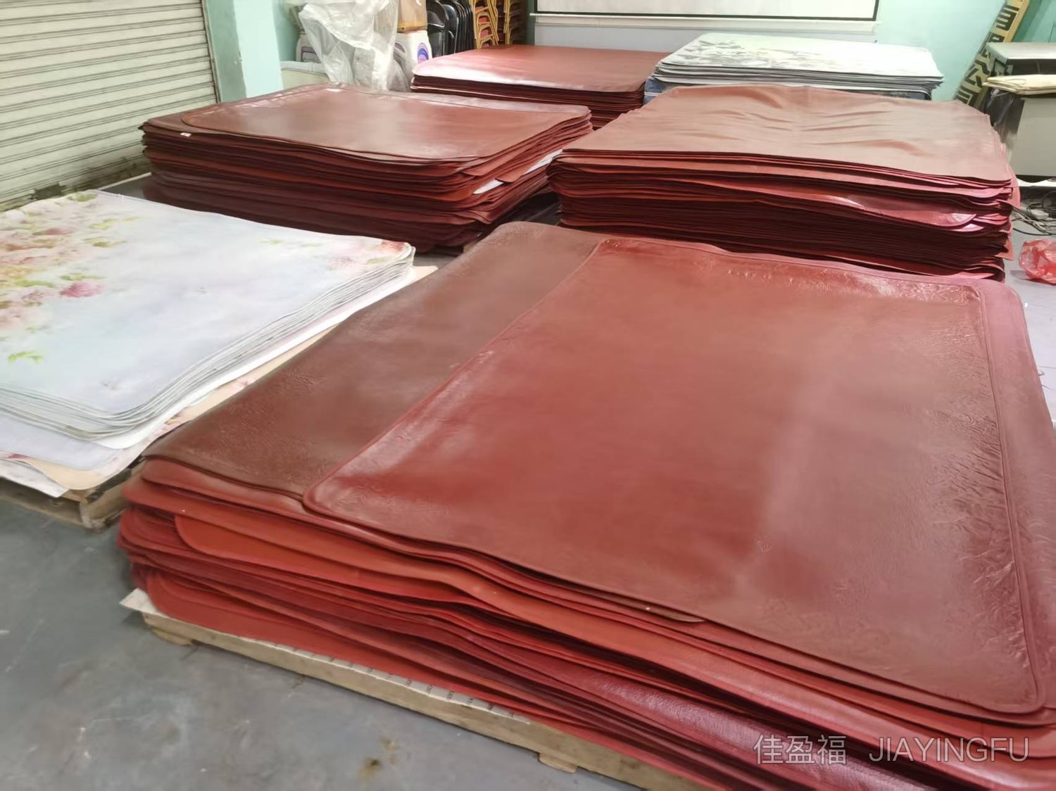 Stacked red cowhide rugs